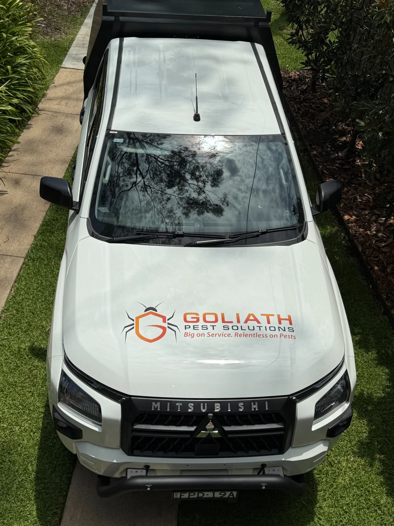 Goliath Pest Solutions logo on vehicle bonnet